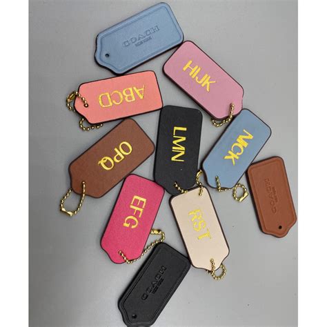 coach monogram tag.